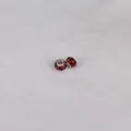 Detailed macro view of 14mm resin beads with red floral patterns and silver cores - 14mm*9mm / Red