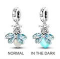 Luminous firefly bead in S925 silver with blue enamel wings showing glow effect - Blue Wing Luminous Firefly (S925)