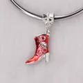 Detail shot of red enamel boot charm with silver spiral pattern and sparkling rhinestone - Red