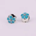Macro detail of blue enamel cherry blossom charms for DIY bead bracelets - Lake Blue