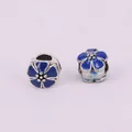 Detailed macro shot of blue enamel cherry blossom beads with large holes for DIY jewelry - Dark Blue