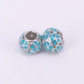Macro detail of silver hollow heart beads with light blue enamel for DIY bracelets - Light Blue
