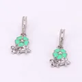 Detail of silver floral earrings with green enamel petals and sparkling rhinestones - Green