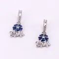 Detail of flower charms with dark blue enamel and white crystals in silver alloy - Blue