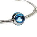 Silver snake chain bracelet with a faceted blue crystal charm bead on white background - Dark Blue