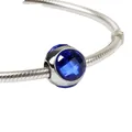 Silver snake chain bracelet featuring a faceted deep blue crystal droplet charm - Blue