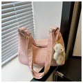 Detailed macro view of pink crinkled fabric texture and cute plush bear charm on tote bag - With Pendant / Pink