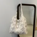 White tote bag featuring vintage blue butterfly prints and 3D feathery textured fabric - Blue Butterfly Style / White