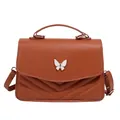 Brown quilted crossbody bag with top handle and decorative white butterfly clasp - Brown