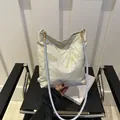 Chic bucket bag with gold and light blue botanical embroidery and metal lobster clasps - Bamboo Leaf