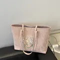Rosafarbene Canvas-Einkaufstasche mit Faltenstruktur und traditioneller Blumenstickerei - Rosa