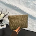 Olive green quilted clutch bag with daisy flower pattern and soft nylon texture - Brown