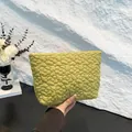 Chic mustard green makeup bag with quilted daisy embroidery and a portable handheld design - Green
