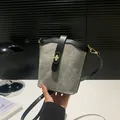 Grey and black contrast bucket bag with gold turn-lock and slim shoulder strap - Light Gray