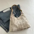 Beige velvet underarm bag with white bamboo leaf print and brown leather handles - Khaki