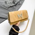 Chic mustard yellow square shoulder bag featuring a silver metal butterfly buckle - Khaki