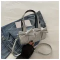Silver cylinder underarm bag with large bows and metallic finish in PU leather - Silver