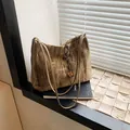 Olive green pleated tote bag with wooden bead detail and elegant shoulder straps - Brown