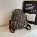 Dark brown leather backpack with silver rabbit metal logo and all-over pattern print - No Pendant / Brown