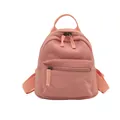 Minimalist light pink canvas backpack with front zipper pocket for casual daily travel - Pink