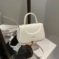 Elegant white faux leather square handbag with golden FASHION logo and top handle - White