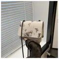 Close-up of butterfly print bag with dark chain strap and textured faux leather - Small Black Style (8613-HJ)