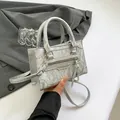 Silver wrinkled metallic crossbody bag with dual top handles and adjustable strap - Silver