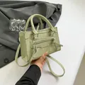 Pale green patchwork square bag with cylindrical handles and adjustable crossbody strap - Green