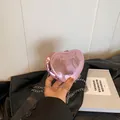Pink heart-shaped crossbody bag in glossy metallic finish with silver chain strap - Pink