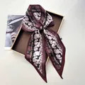 Elegant wine red horse and chain pattern silk scarf tied in a bow on a luxury display tray - Burgundy Base Black Horse Gold Chain (Style 7)