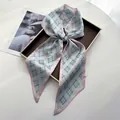 Pink plaid silk ribbon scarf tied in a bow with classic check pattern detail - Soft Pink Base Blue-Green Plaid Classic Style (Style 20)