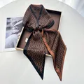 Brown and black geometric silk scarf tied in a bow on a white tray for elegant styling - Brown & Black Diamond Pattern Satin Style (Style 23)