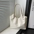 Chic cream ruched shoulder bag in soft faux leather with a minimalist tote design - White