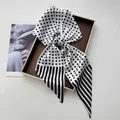Polka dot and stripe pattern silk satin scarf displayed on a golden tray with a magazine - Black & White Polka Dot Striped Patchwork Style (Style 43)