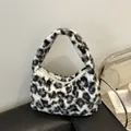 Chic black and white leopard print plush faux fur hobo bag with a soft crescent silhouette - White