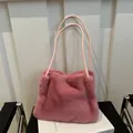 Pink faux fur tote bag for women featuring soft plush texture and matching shoulder straps - Pink
