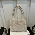 Off-white plush faux fur tote bag with slim tan leather straps for winter season - Khaki