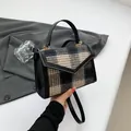 Vintage checkered wool handbag with black leather trim and elegant gold hardware - Black