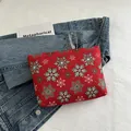 Pochette de Noël rouge à motifs de flocons de neige pour cosmétiques et usage quotidien - Flocon de neige