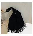 Detail of black suede tote bag with long bohemian fringes and wide shoulder strap - Black