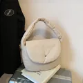 Quilted padded shoulder bag in cream white with silver metallic buckle detail - Khaki