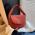 Quilted brick red shoulder bag with padded handle and silver metallic snap button - Brown