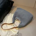 Fluffy blue lambskin tote bag with brown leather straps for elegant winter commute - Haze Blue