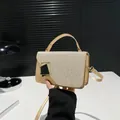 Champagne gold glitter evening bag with geometric clasp and detachable shoulder strap - Gold