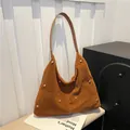 Brown suede hobo bag with gold rivet detailing and elegant shoulder strap design - Dark Brown