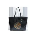 Black tote bag featuring a golden elephant totem embossed with ethnic patterns - Black
