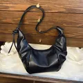 Retro black dumpling shoulder bag in soft pleated leather with knot strap detail - Black