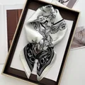 Detail of cartoon floral print on premium white satin scarf inside an elegant gift box - White