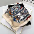 Macro detail of silk-feel paisley square scarf with vintage multi-color pattern design - Nude