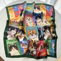 Detail of square silk scarf showing cute cartoon cat patterns on a soft white table - Green